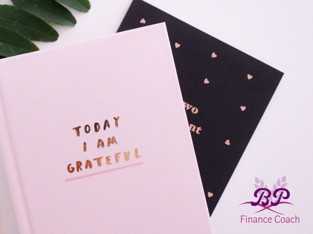 pink journal, gratitude and finance